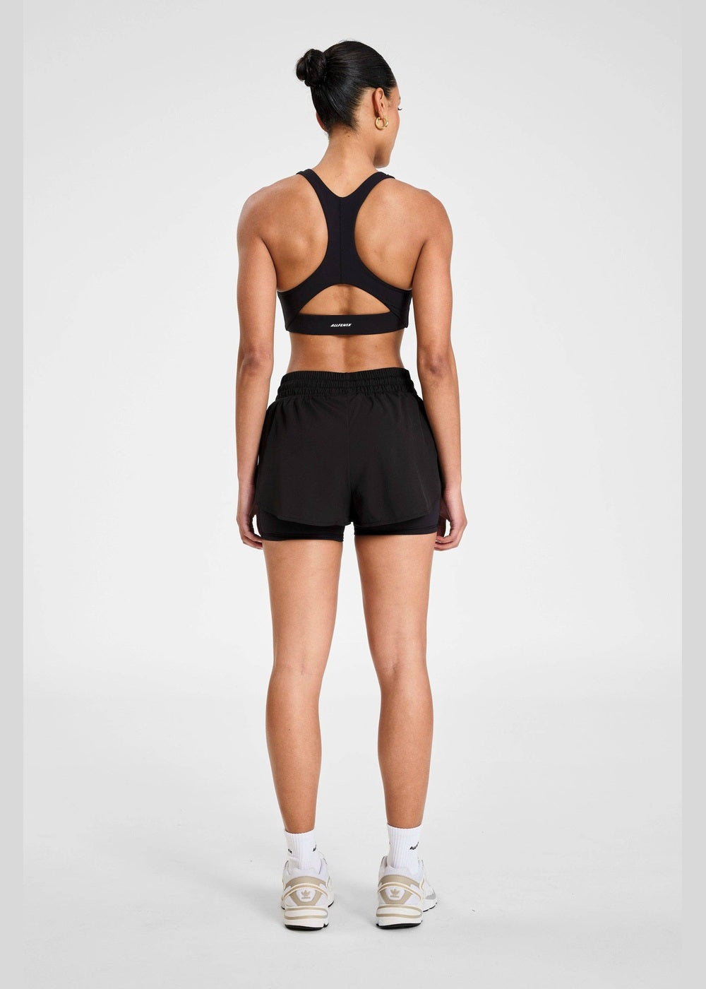 ALLFENIX EcoSculpt Running Short in Black, full outfit from back