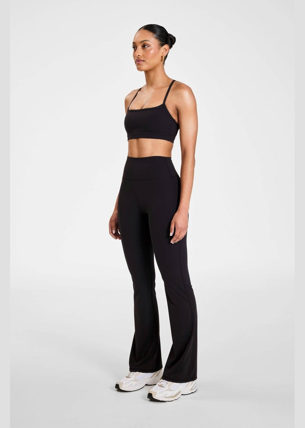 ALLFENIX CloudCore Flared Legging in Onyx black, three-quarter view