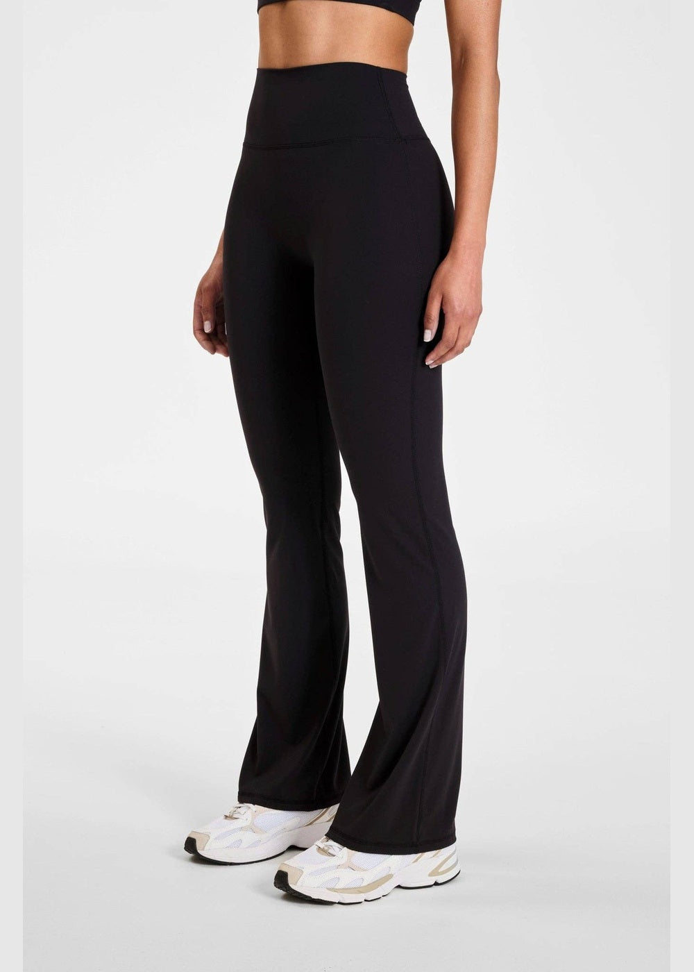 ALLFENIX CloudCore Flared Legging in Onyx black, side view of flared hem