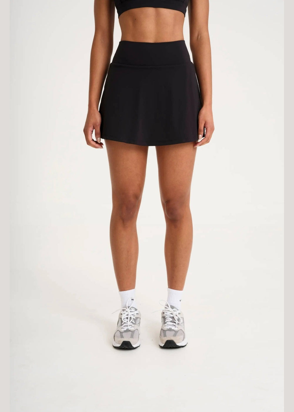 ALLFENIX CloudCore Active Skort in Onyx black, front view