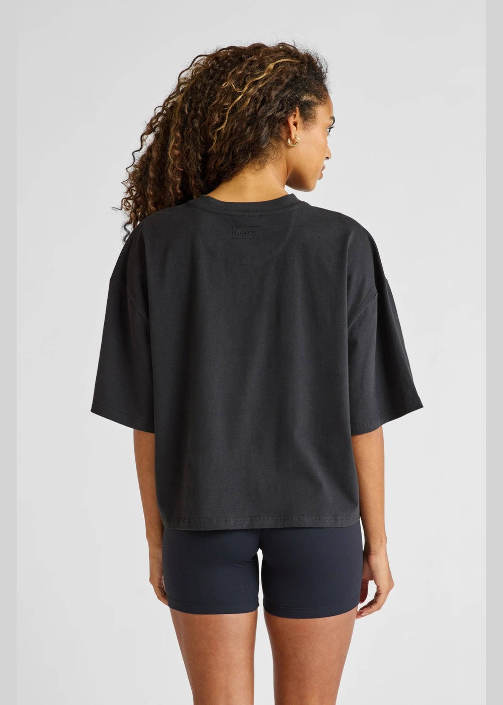ALLFENIX Oversized Cropped Tee – Black – rear three-quarter view
