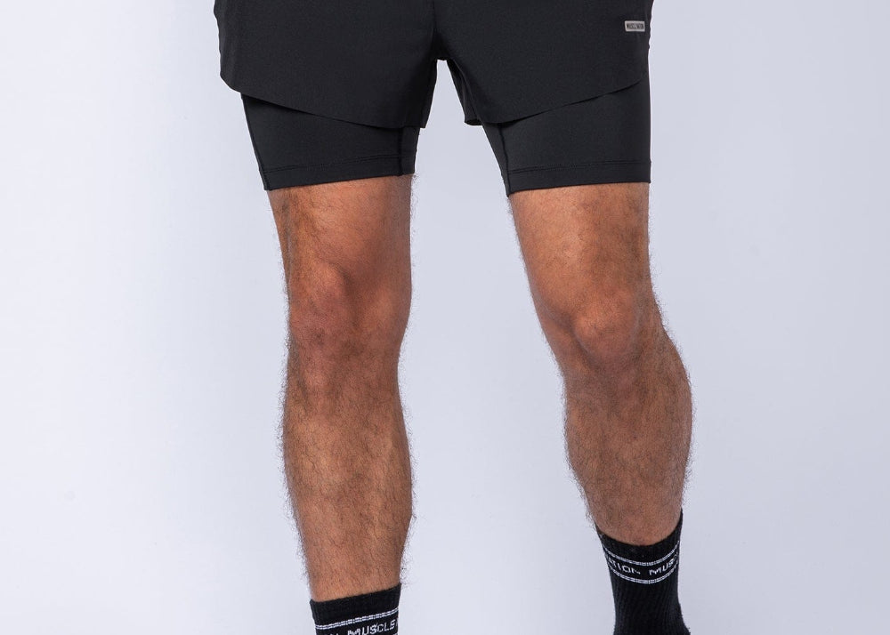 Black athletic shorts with an integrated built-in compression liner