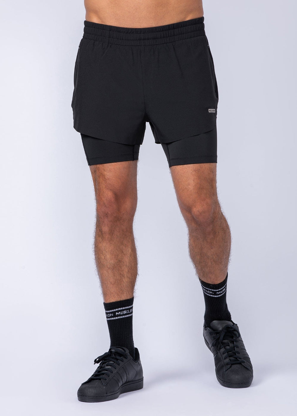 Black athletic shorts with an integrated built-in compression liner